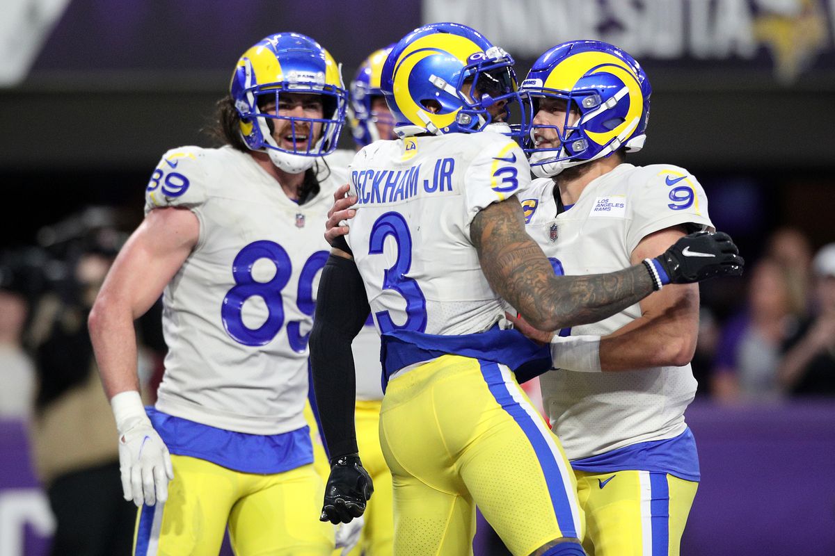 Odell Beckham Jr. #3 of the Los Angeles Rams celebrates with Matthew Stafford #9 after Beckham Jr. scored a touchdown reception in the fourth quarter against the Minnesota Vikings at U.S. Bank Stadium on December 26, 2021 in Minneapolis, Minnesota.