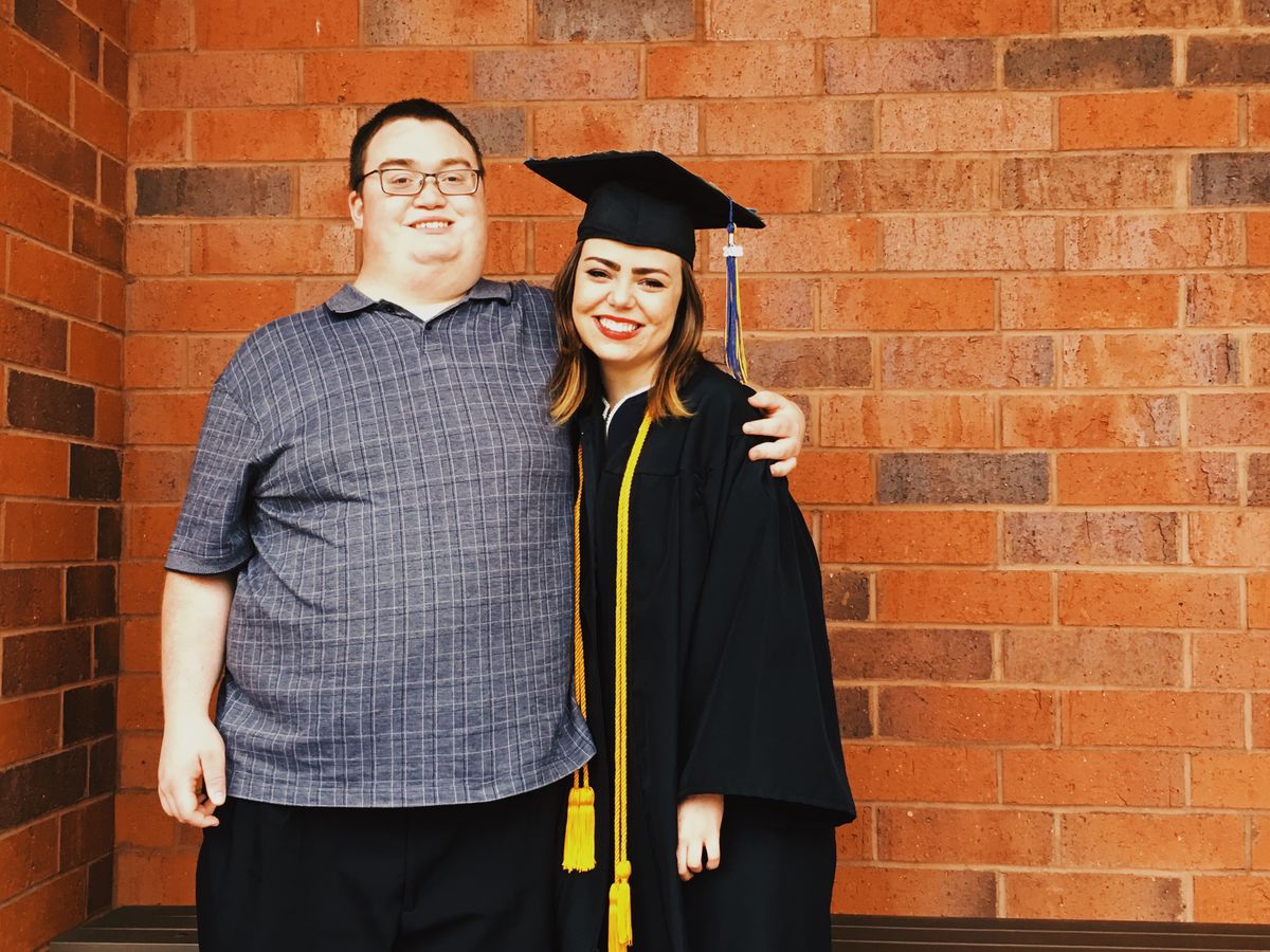 Samantha West of Chalkbeat poses for a photo with her brother Alex after graduating from the University of Wisconsin-Eau Claire in May 2018.