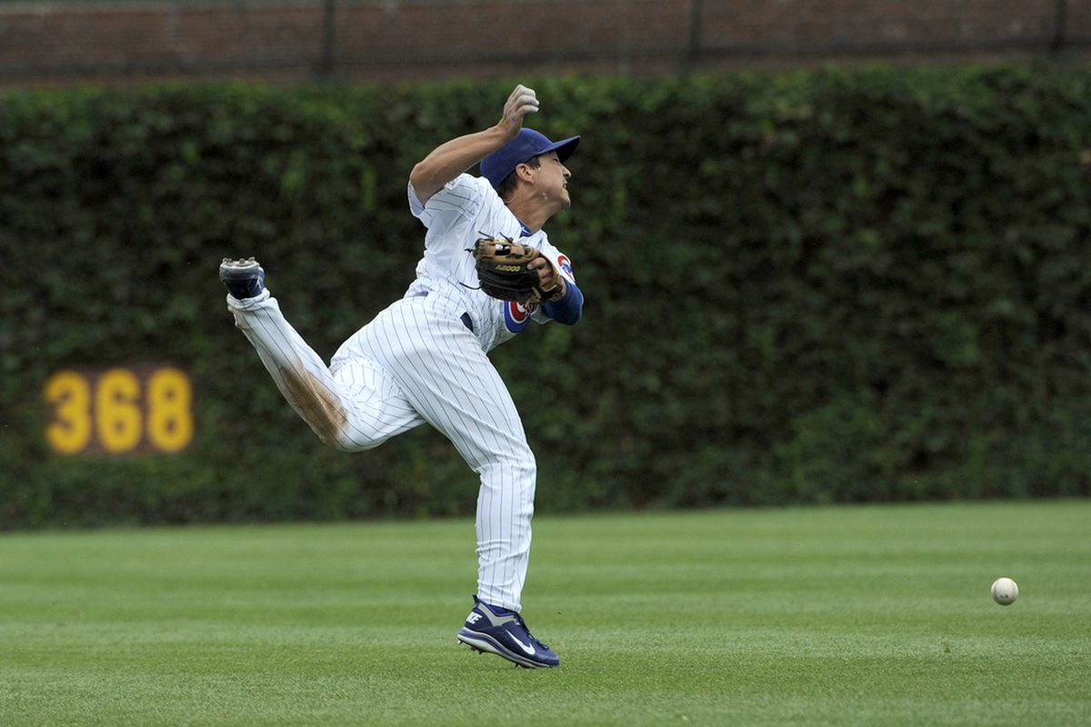Write your own caption! Darwin Barney of the Chicago Cubs can't make a catch against the Cincinnati Reds at Wrigley Field in Chicago, Illinois. (Photo by David Banks/Getty Images) 