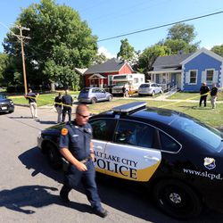 Salt Lake police officers investigate a shooting at 757 W. 200 North in Salt Lake City on Tuesday, Aug. 15, 2017. Police say a suspect was taken into custody at 800 North and North Temple.