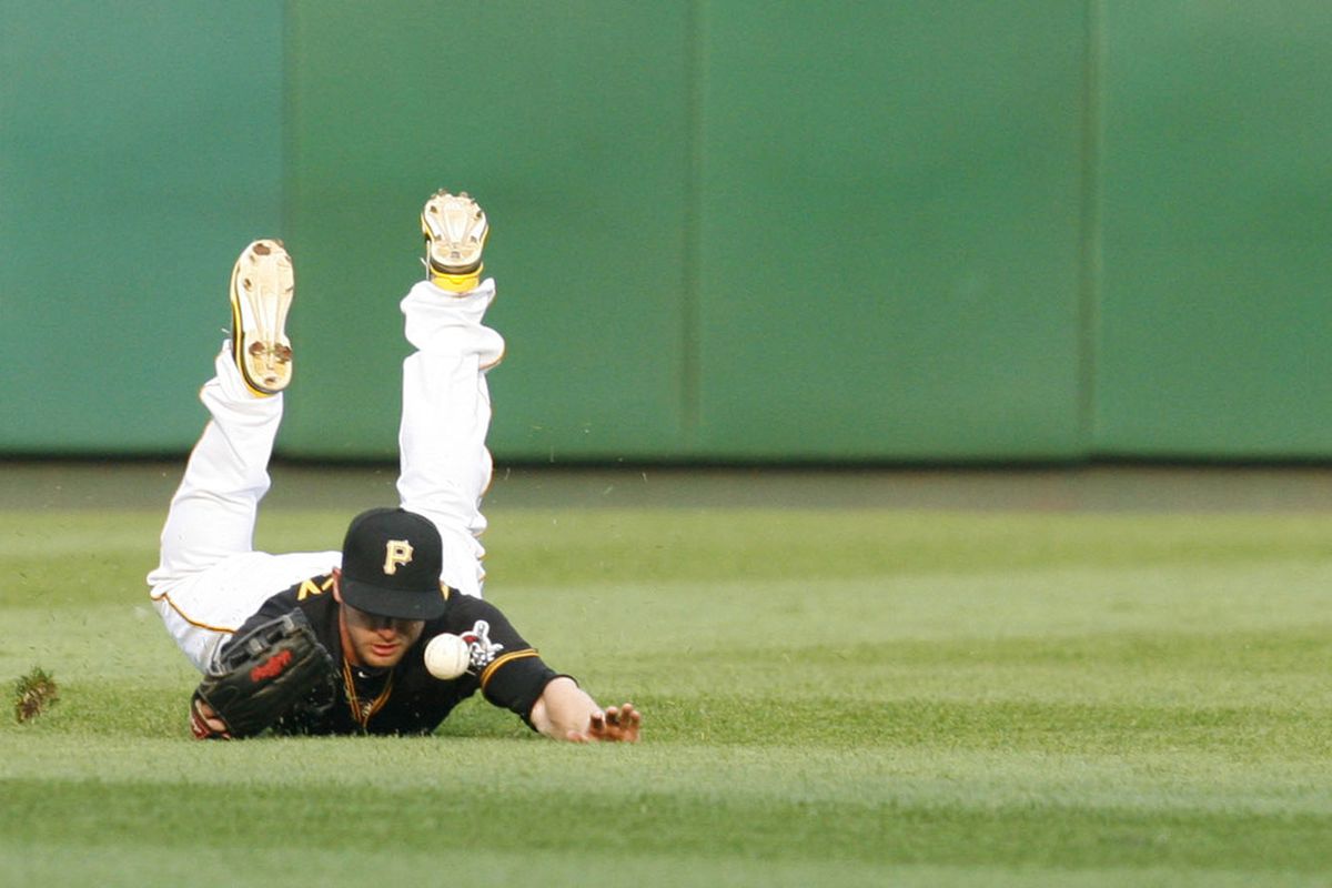 July 3, 2012; Pittsburgh, PA, USA; Pittsburgh Pirates left fielder Alex Presley (7) fails to catch a ball hit by Houston Astros shortstop Jed Lowrie (not pictured) during the first inning at PNC Park. Mandatory Credit: Charles LeClaire-US PRESSWIRE