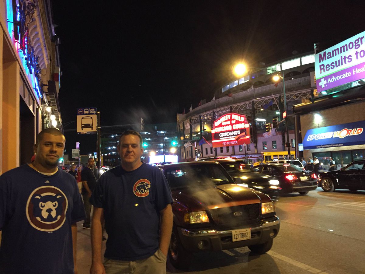 Mario Schumann of South Elgin (left) and Brett O’Neill of Streamwood went to the Cubs game and then monitored the Cardinals game from a bar across the street from Wrigley Field. | Sam Charles/Sun-Times