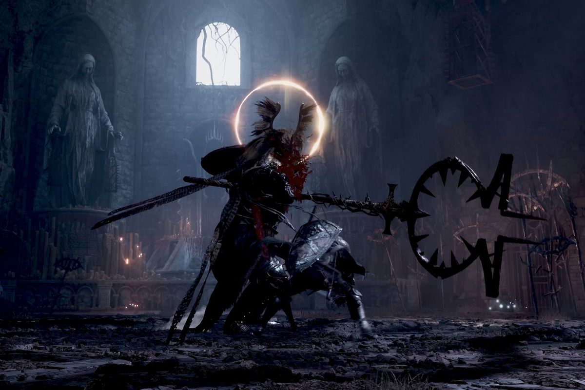 A knight slashes at a giant armored warrior in a church environment in a screenshot from The Lords of the Fallen