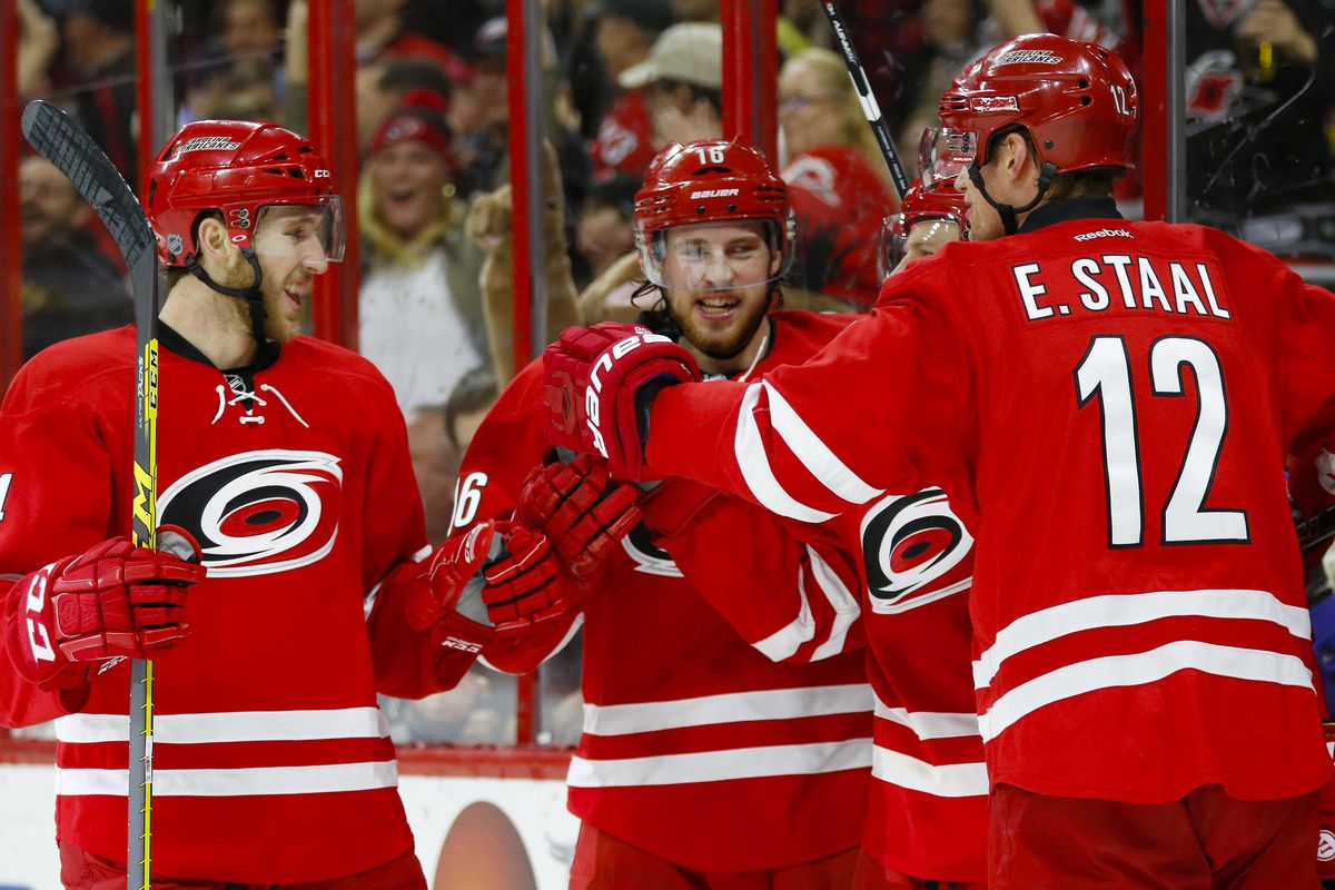 Jaccob Slavin, Elias Lindholm (center) and Eric Staal were all catalysts in Carolina’s 3-2 overtime win Tuesday at PNC Arena.