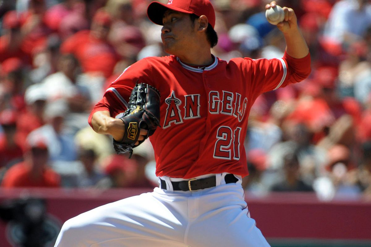 Jun 3, 2012; Anaheim, CA, USA; Los Angeles Angels reliever Hisanori Takahashi (21) delivers a pitch against the Texas Rangers at Angel Stadium. The Rangers defeated the Angels 7-3. Mandatory Credit: Kirby Lee/Image of Sport-US PRESSWIRE