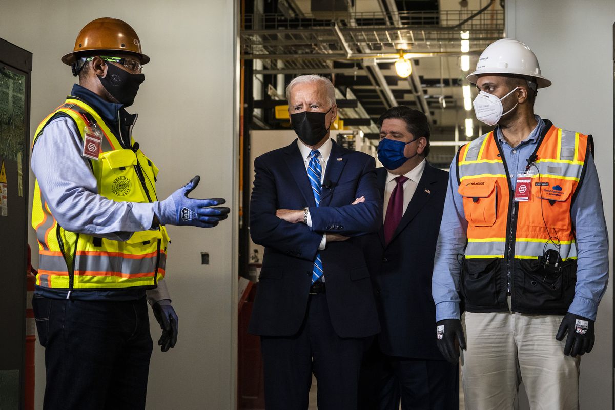President Joe Biden joins Gov. J.B. Pritzker and workers on a tour of a data center under construction by Clayco in Elk Grove Village, Thursday afternoon, Oct. 7, 2021.