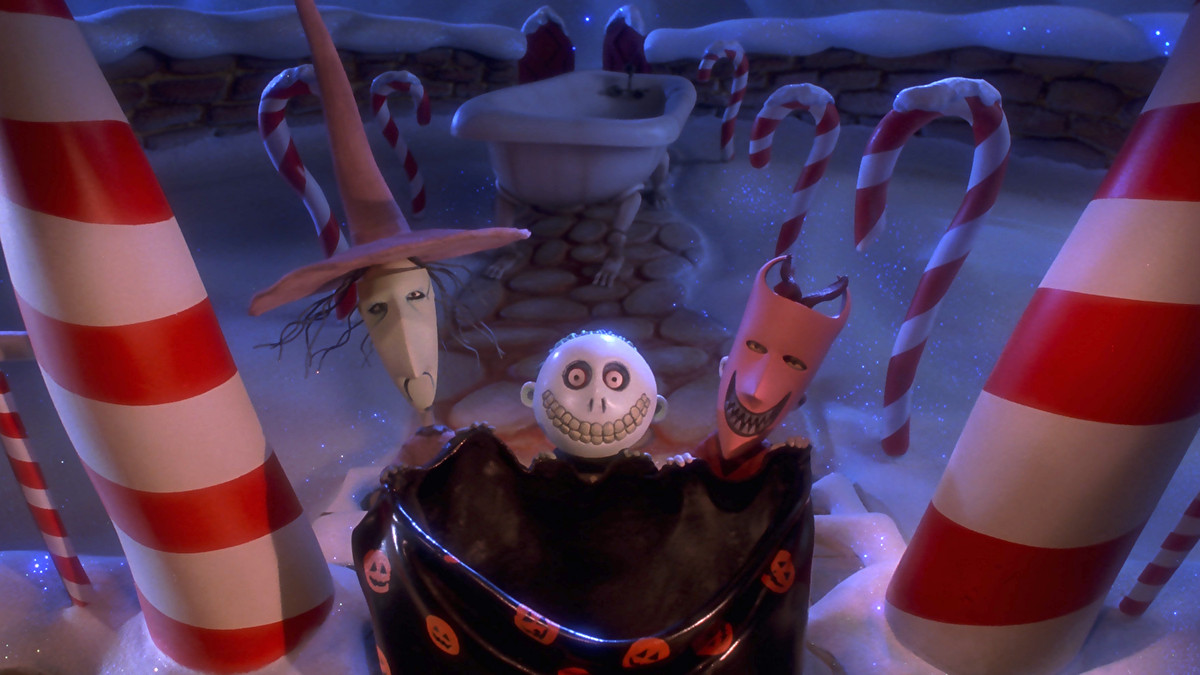Lock, Shock, and Barrel, three young ghouls in halloween masks, hold a huge trick-or-treat bag open on Santa’s doorstep in The Nightmare Before Christmas