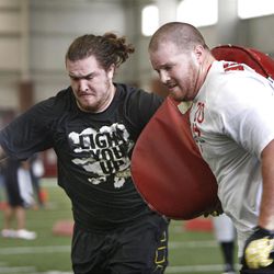 Utah's John Cullen, left, and Tony Bergstrom run through drills at Utah Pro Day where departing University of Utah senior football players and some invitees work out for NFL scouts in Spence Eccles Field House Friday, March 23, 2012, in Salt Lake City, Utah.   