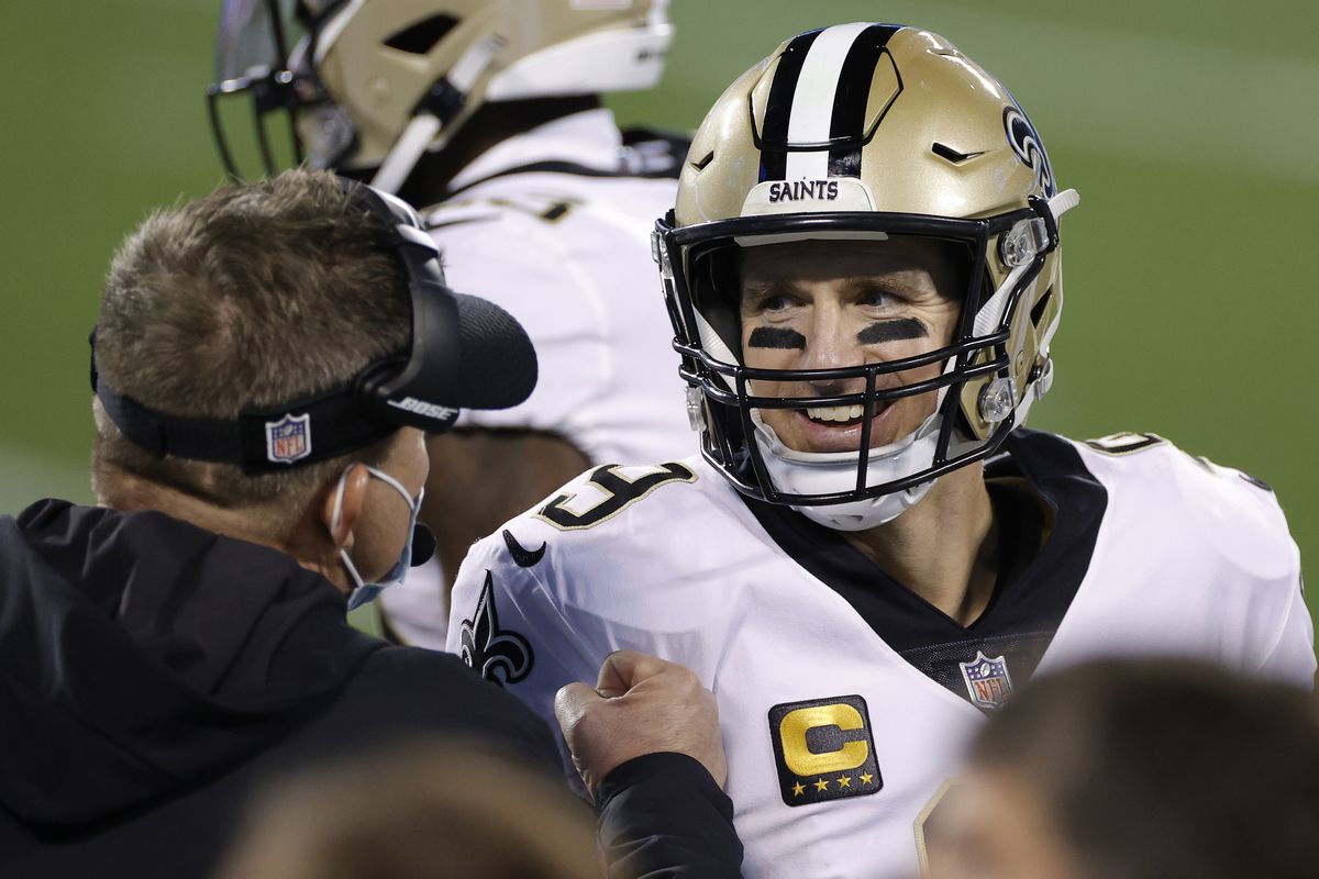 Quarterback Drew Brees #9 of the New Orleans Saints reacts with head coach Sean Payton during the second half of their game against the Carolina Panthers at Bank of America Stadium on January 03, 2021 in Charlotte, North Carolina.