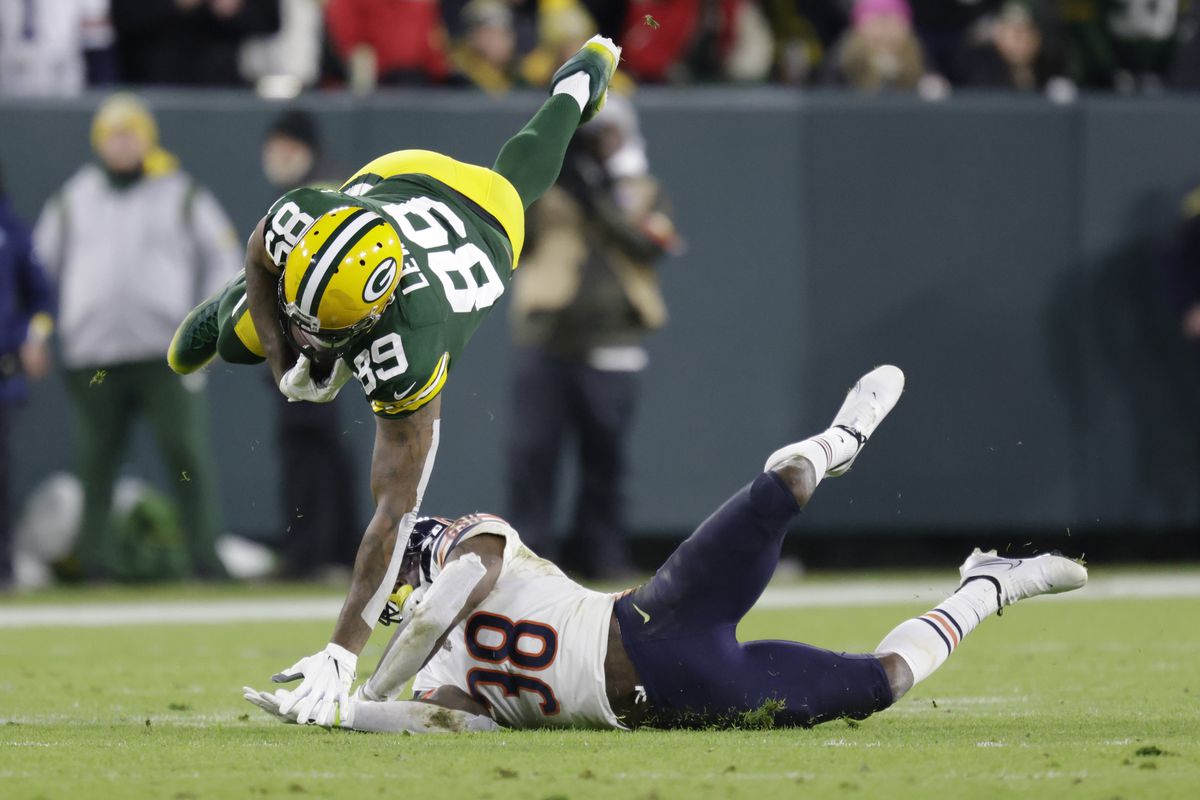 Bears safety Tashaun Gipson (38) tackles Packers tight end Marcedes Lewis in the Packers 45-30 victory over the Bears on Sunday night at Lambeau Field.