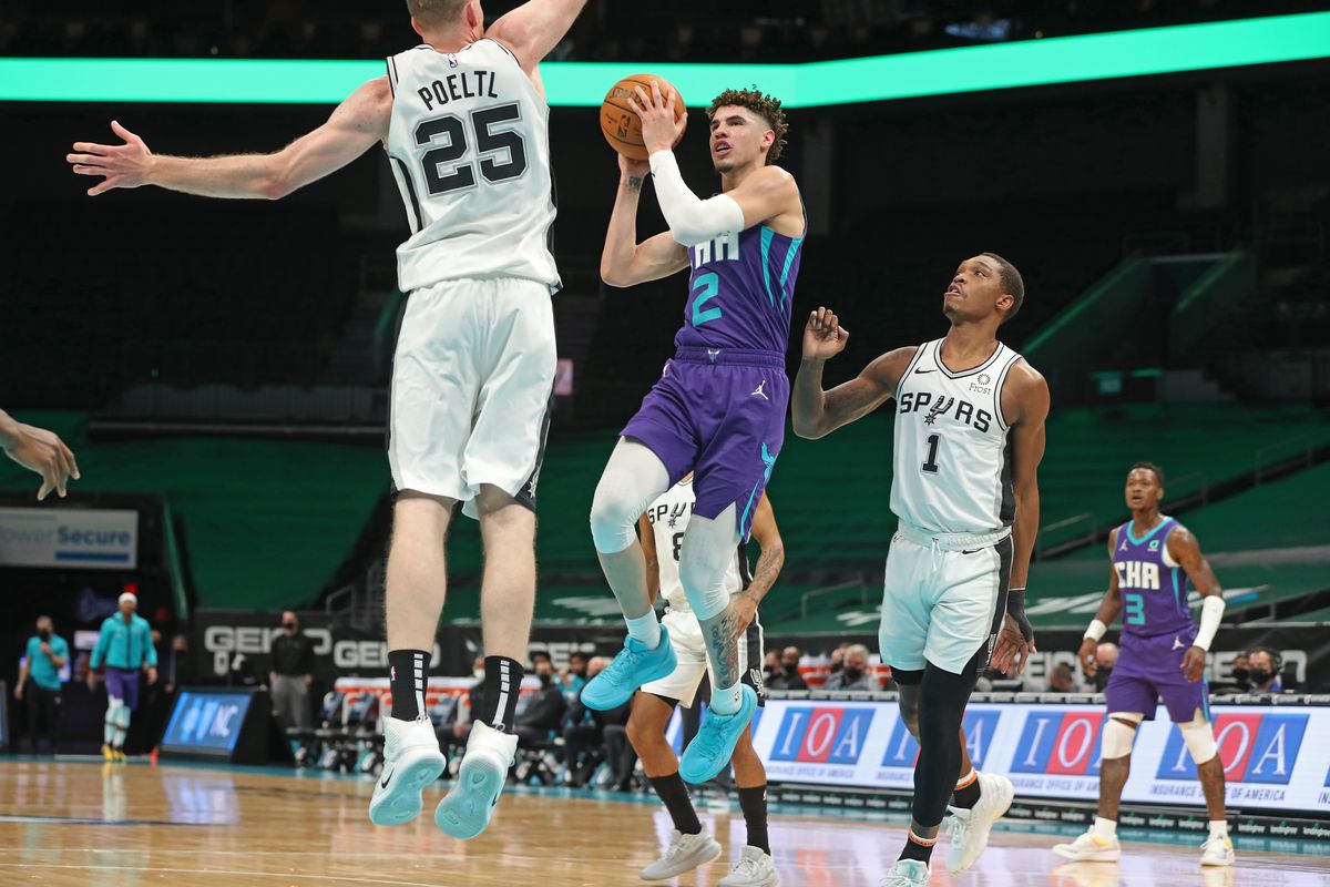 LaMelo Ball of the Charlotte Hornets drives to the basket against the San Antonio Spurs on February 14, 2021 at Spectrum Center in Charlotte, North Carolina.