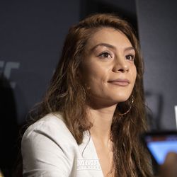 Nicco Montano answers a question at UFC 228 media day.
