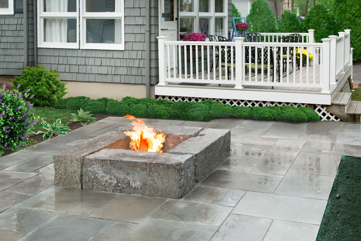 Fire pit patio made of granite blocks.