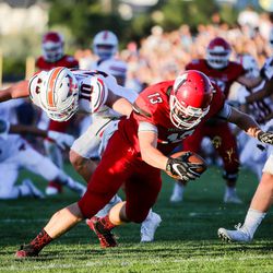 American Fork's Mitchell Johnson (13) stretches across the goal line for the first score of the game as Timpview High School takes on American Fork High School at American Fork High in high school football action in American Fork, Utah on Friday, Aug. 25, 2017.