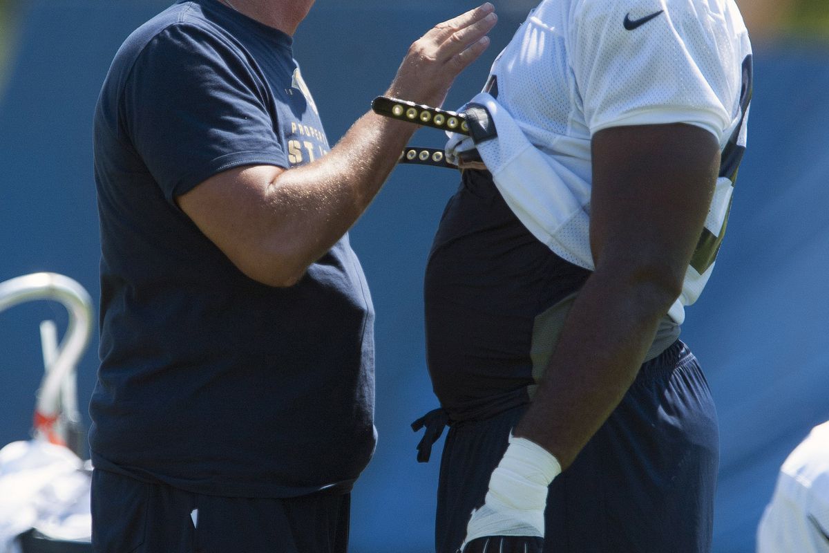 July 27, 2012; St. Louis, MO, USA; St. Louis Rams defensive line coach Mike Waufle talks with defensive tackle Michael Brockers (90) during training camp at ContinuityX Training Center. Mandatory Credit: Jeff Curry-US PRESSWIRE