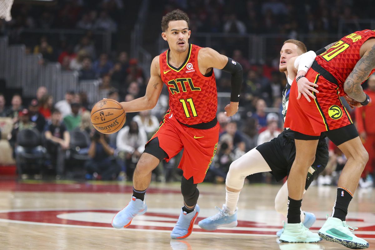 &nbsp;Atlanta Hawks guard Trae Young dribbles the ball against the Milwaukee Bucks in the first half at State Farm Arena.&nbsp;