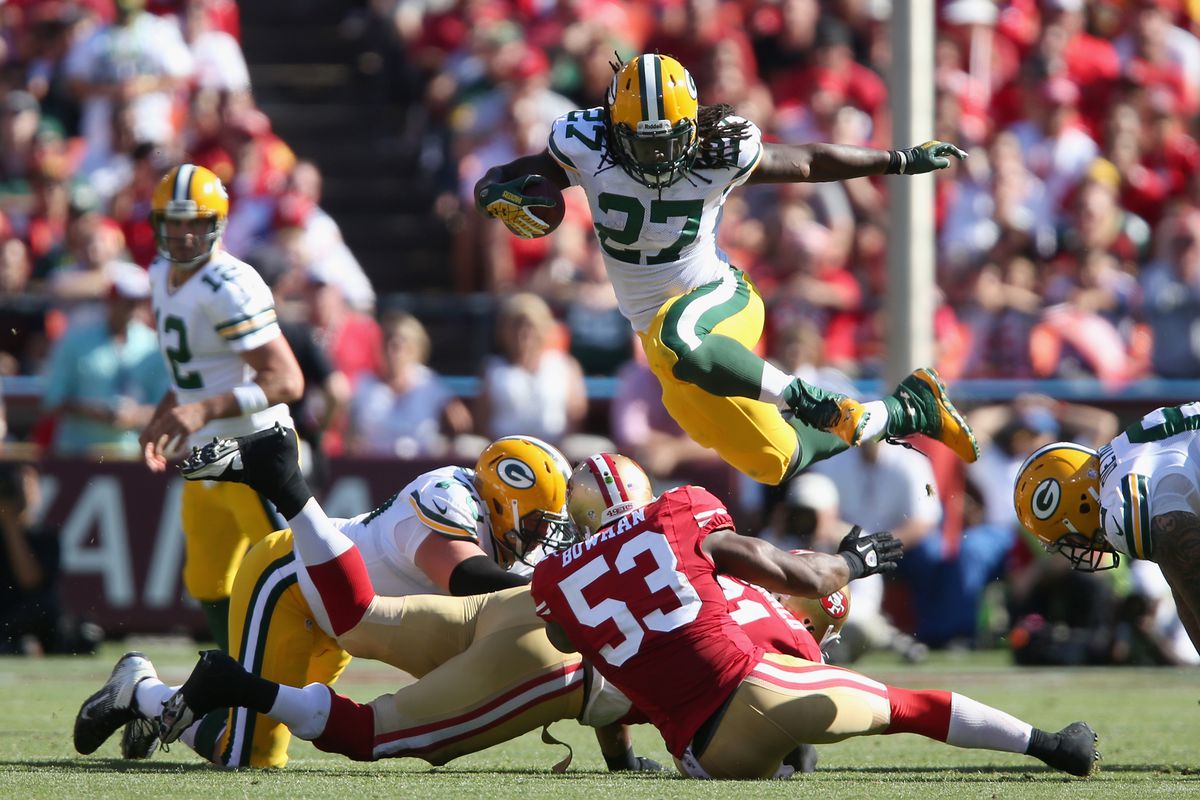 Eddie Lacy (27) hurdles over a pile during Sunday's game against the 49ers