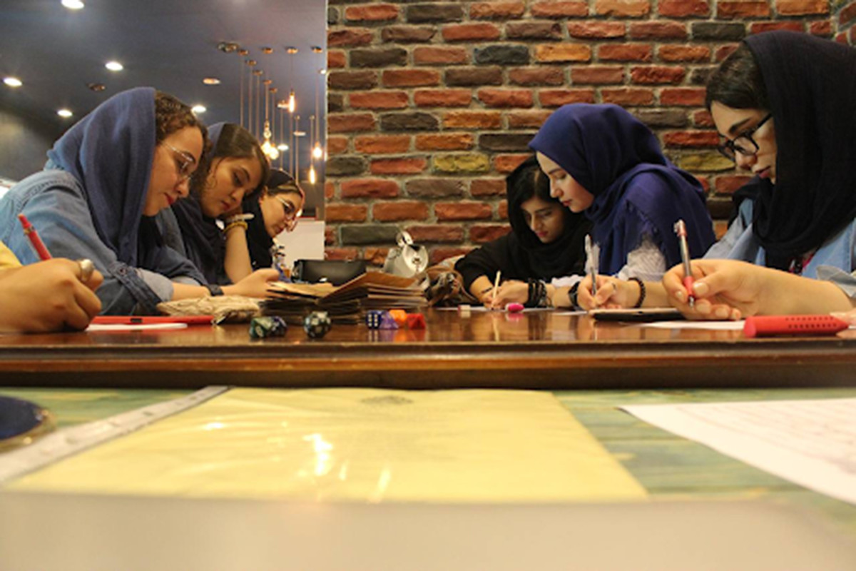 Six young women in hijab playing D&D