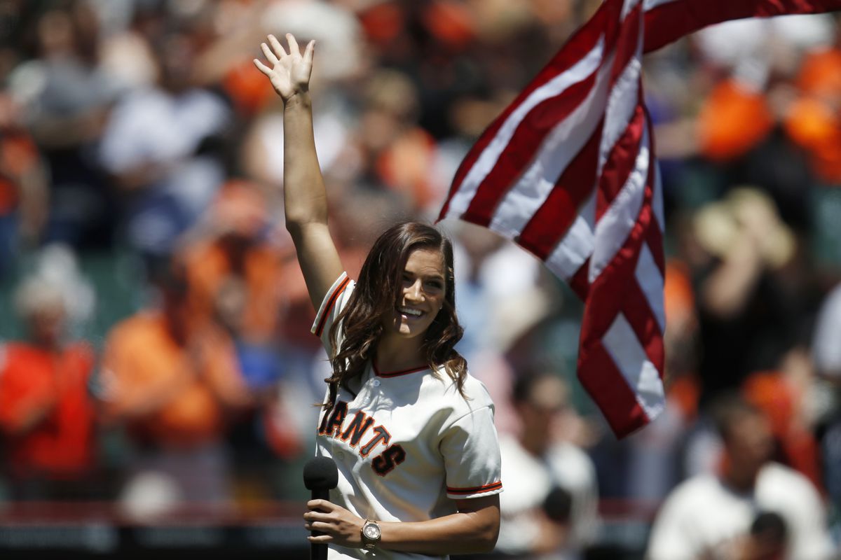 University of California Berkeley soccer player Grace Leer waves to the crowd after singing the national anthem before the San Francisco Giants game against the Arizona Diamondbacks at AT&amp;T Park in San Francisco, Calif., on Sunday, July 13, 2014. (Nhat V