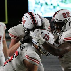 Celebration after Northern Illinois’ Tre Harbison punches it in