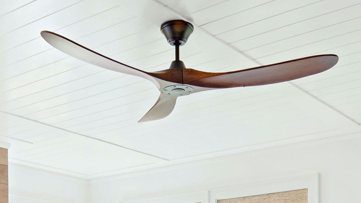 How much of a distance below the ceiling should the fan blades be positioned for the greatest amount of air movement?