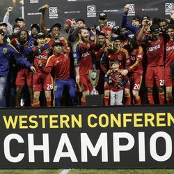 Real Salt Lake soccer players celebrate after they beat the Portland Timbers to win the Western Conference finals in the MLS Cup soccer playoffs, Sunday, Nov. 24, 2013, in Portland, Ore. (AP Photo/Ted S. Warren)