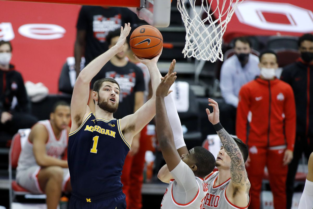 Michigan Wolverines center Hunter Dickinson defended by Ohio State Buckeyes forward E.J. Liddell during the first half at Value City Arena.