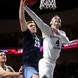 Brigham Young Cougars guard Nick Emery (4) is fouled by San Diego Toreros forward Yauhen Massalski (25) as the BYU Cougars and San Diego Toreros play in WCC tournament action at the Orleans Arena in Las Vegas on Saturday, March 9, 2019.