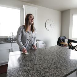Noelle Hoyne cleans the kitchen in her home in Stansbury Park on Wednesday, April 17, 2019. Stansbury Park is a more affordable area compared to the Wasatch Front, which has been booming due to hot housing market.