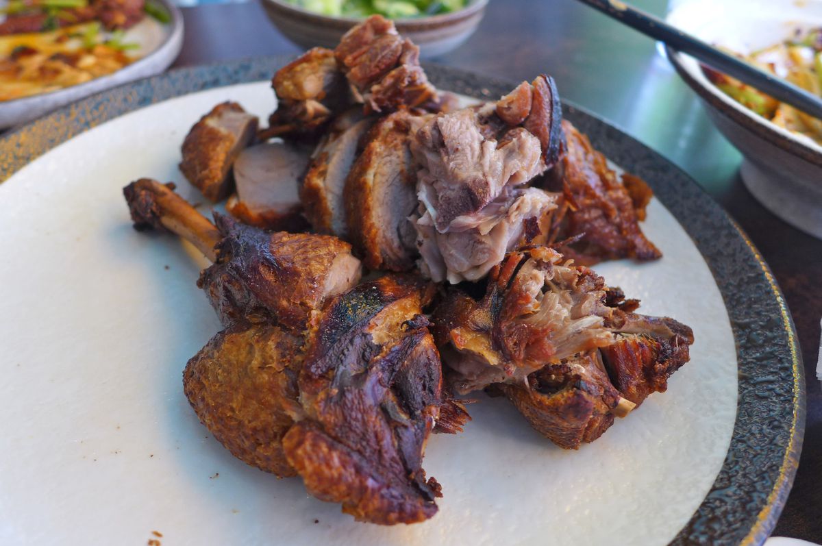 A pile of slightly charred duck, about half a bird.
