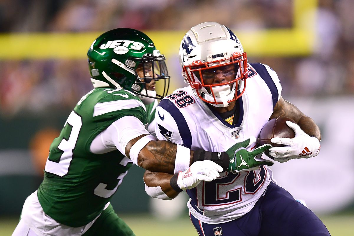 Jamal Adams of the New York Jets tackles James White of the New England Patriots during the second half of their game at MetLife Stadium on October 21, 2019 in East Rutherford, New Jersey.