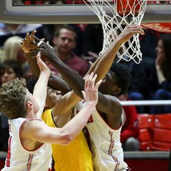 California Golden Bears forward Justice Sueing (10) meets heavy resistance from Utah Utes forward Jayce Johnson (34) and forward Donnie Tillman (3) at the Huntsman Center in Salt Lake City on Saturday, Feb. 10, 2018.