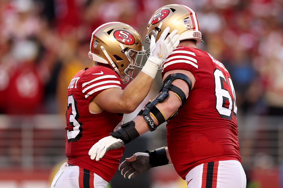 Brock Purdy #13 and Jake Brendel #64 of the San Francisco 49ers celebrate a touchdown against the New York Giants during the second quarter in the game at Levi’s Stadium on September 21, 2023 in Santa Clara, California.