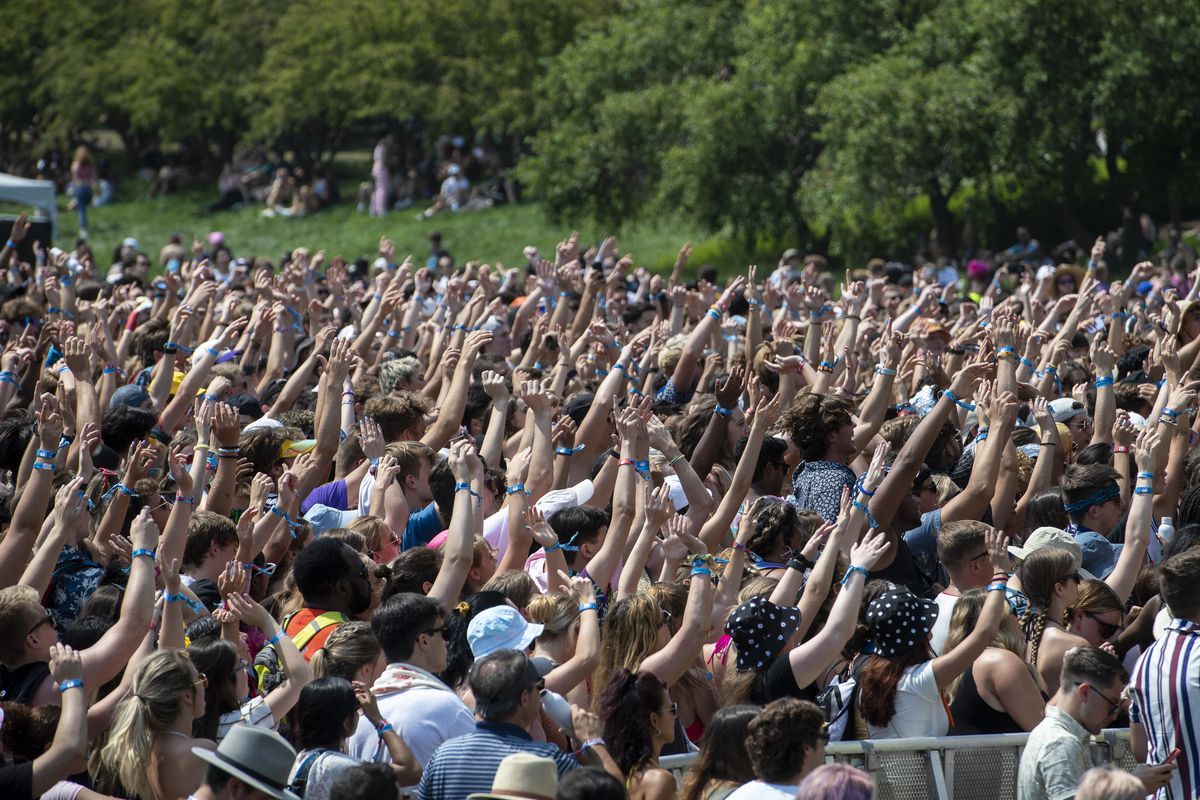 Fans wave their hands in the air as Max preforms at the Lake Shore Stage.