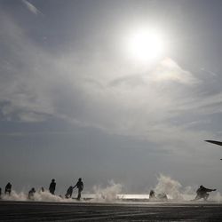 In this picture taken on Monday, Nov. 21, 2016, U.S. Navy fighter jet takes off from the deck of the U.S.S. Dwight D. Eisenhower aircraft carrier. The carrier is currently deployed in the Persian Gulf, supporting Operation Inherent Resolve, the military operation against Islamic State extremists in Syria and Iraq. 