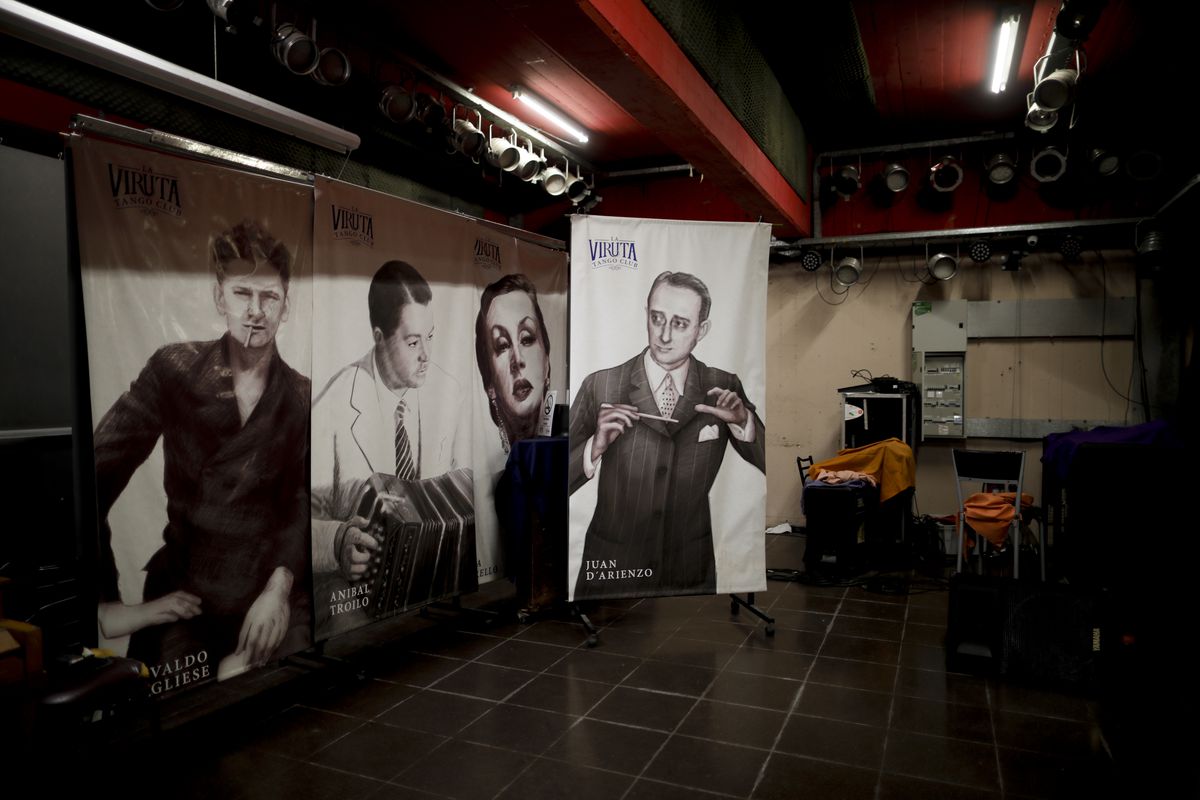 Posters of Argentine tango musicians (from right) Juan d’Arienzo, Tita Merello, Aníbal Troilo and Osvaldo Pugliese decorate a stage in Buenos Aires at La Viruta Tango club, closed for more than a year now by the COVID-19 pandemic.