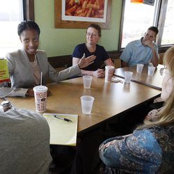Mia Love, back left, talks with delegates at Fazoli's in West Jordan, Tuesday, April 3, 2012, to encourage them to support her for the 4th Congressional District at the upcoming State GOP Convention.