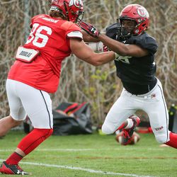 Defensive back Javelin Guidry, right, and tight end Zach Hansen run a drill during a University of Utah football practice at their outdoor practice facility in Salt Lake City on Tuesday, April 10, 2018.