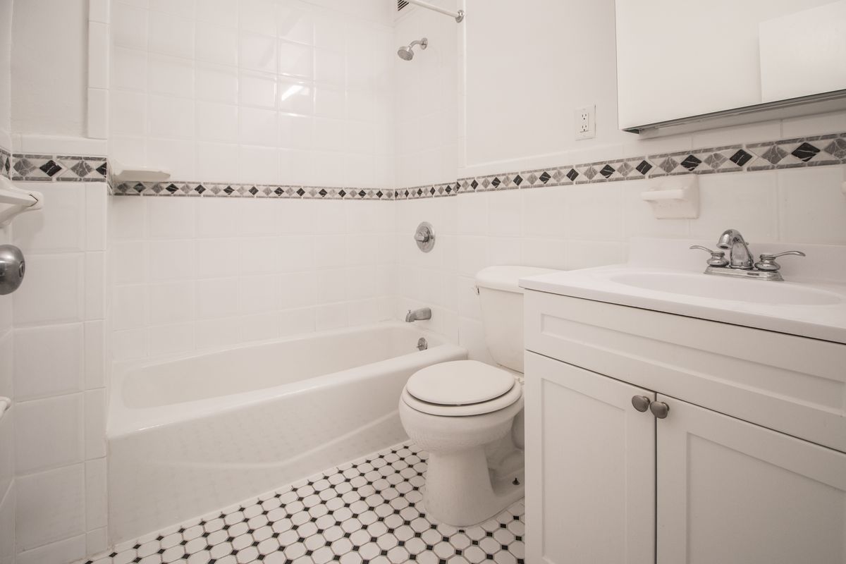 A bathroom with hexagon tiles.