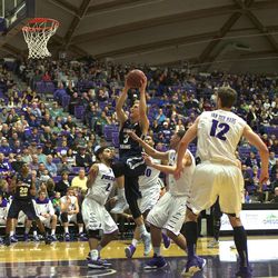 BYU senior guard Tyler Haws becomes BYU’s all-time leading scorer with a shot inside the paint in the Thursday, Feb. 26, 2015, against the University of Portland in Portland. Haws broke the 2011 record of 2,599 points set by Jimmer Fredette. 
