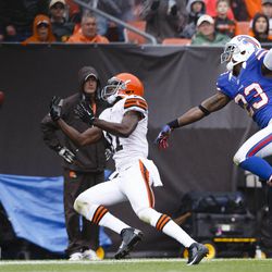 Cleveland Browns wide receiver Mohamed Massaquoi (11) can't reach a pass as Buffalo Bills cornerback Aaron Williams (23) defends during the second quarter at Cleveland Browns Stadium.
