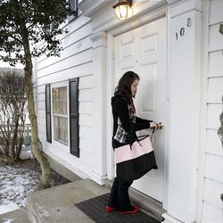 Ashley Robinson, 18, a student at the English Nanny & Governess School, heads into her dormitory home in Chagrin Falls, Ohio.