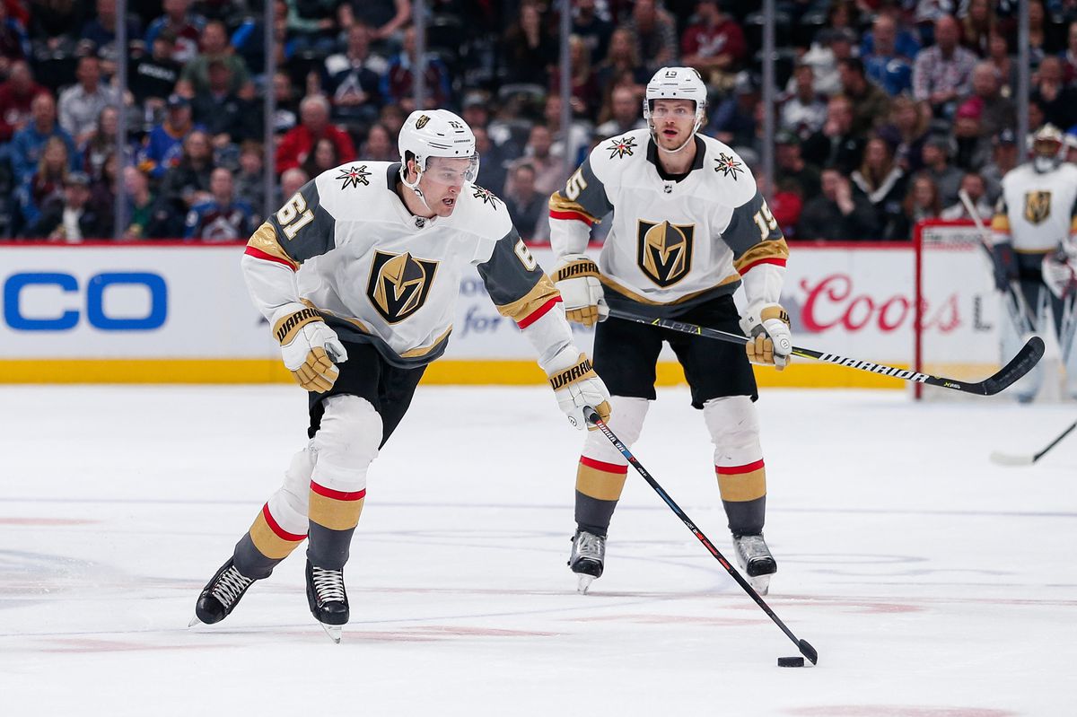 Mar 27, 2019; Denver, CO, USA; Vegas Golden Knights right wing Mark Stone (61) controls the puck ahead of defenseman Jon Merrill (15) in the third period against the Colorado Avalanche at the Pepsi Center. Mandatory Credit: Isaiah J. Downing