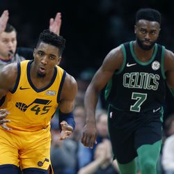 Utah Jazz's Donovan Mitchell (45) in front of Boston Celtics' Jaylen Brown (7) after making a three-pointer during the second half on an NBA basketball game in Boston, Saturday, Nov. 17, 2018. (AP Photo/Michael Dwyer)