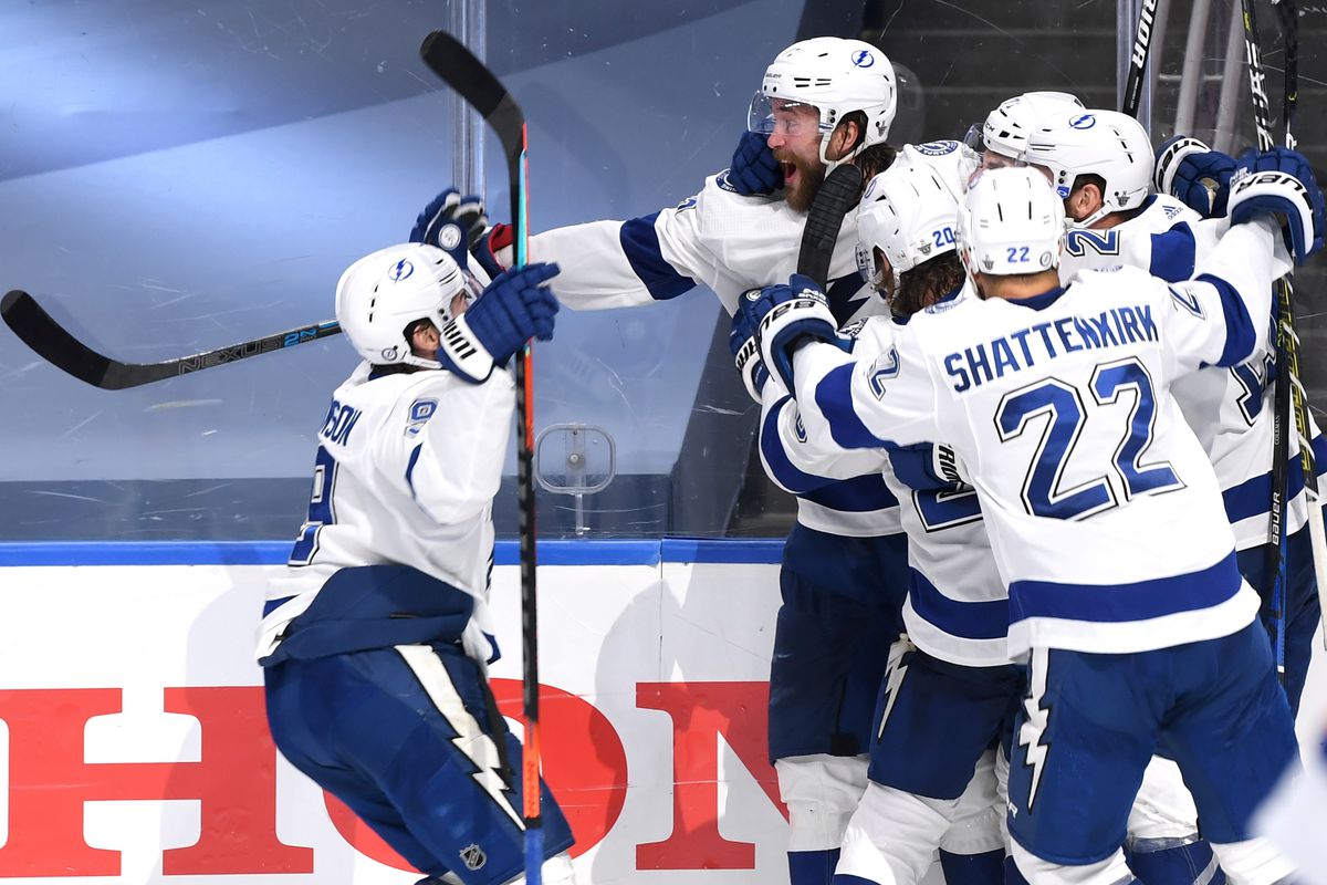 Anthony Cirelli of the Tampa Bay Lightning celebrates after scoring the game-winning goal with teammates Victor Hedman and Tyler Johnson against the New York Islanders for the 2-1 win in the first overtime period of Game 6 of the Eastern Conference Final of the 2020 NHL Stanley Cup Playoffs at Rogers Place on September 17, 2020 in Edmonton, Alberta.