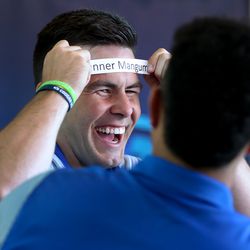 BYU quarterback Tanner Mangum plays a game with teammate Moroni Laulu-Pututau during a video interview at the BYU football media day in the BYU Broadcasting Building on the BYU campus in Provo on Friday, June 22, 2018.