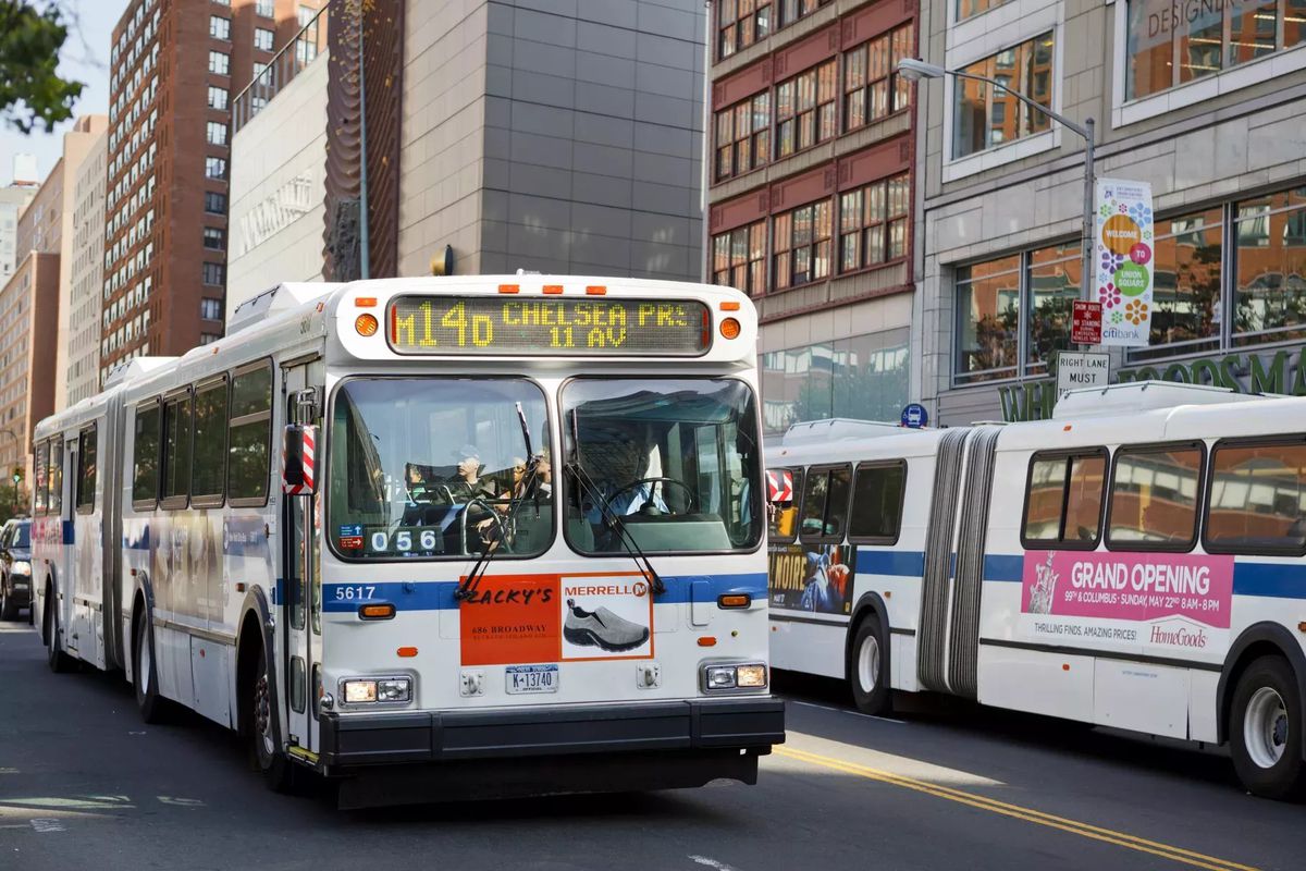 A pair of blue and white M14 buses on 14th Street.