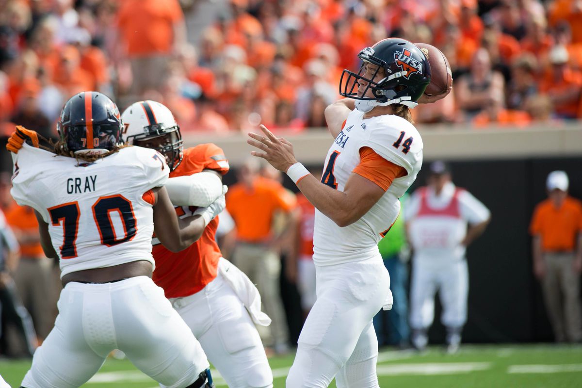 Dalton Sturm rears back to fire a pass against Oklahoma State. The walk-on entered the game after a fourth turnover from starter Blake Bogenschutz.