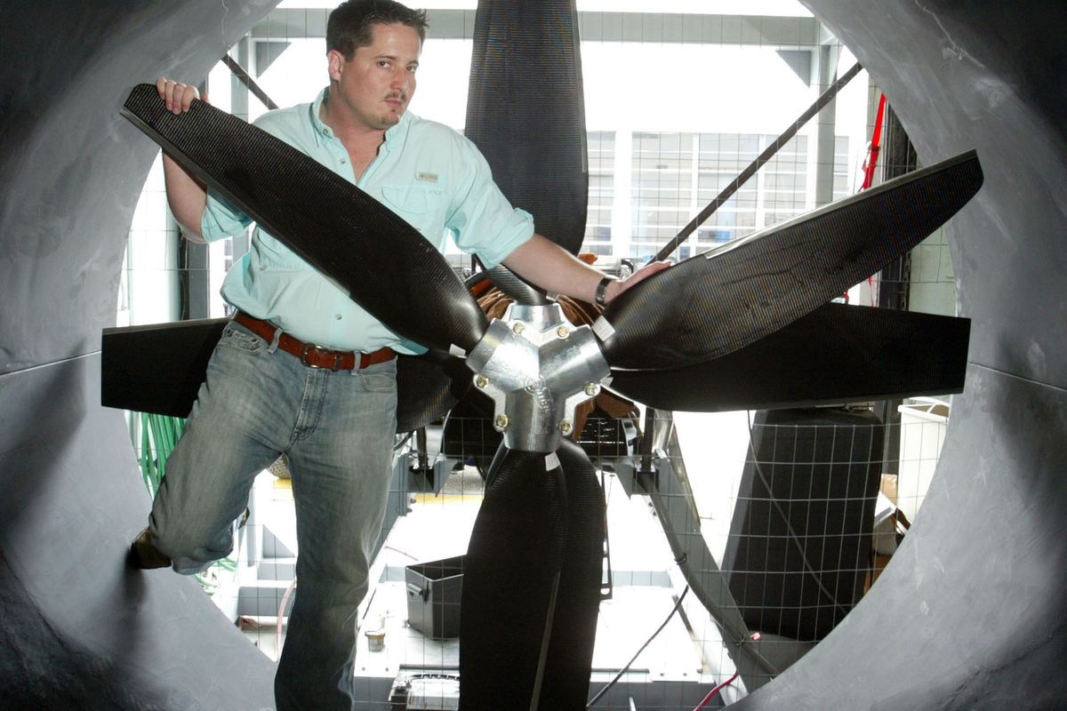Forrest Masters stands inside a wind tunnel that can generat