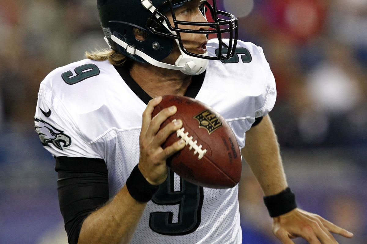 Aug 20, 2012; Foxborough, MA, USA; Philadelphia Eagles quarterback Nick Foles (9) runs away from pressure against the New England Patriots during the first half at Gillette Stadium.  Mandatory Credit: Mark L. Baer-US PRESSWIRE